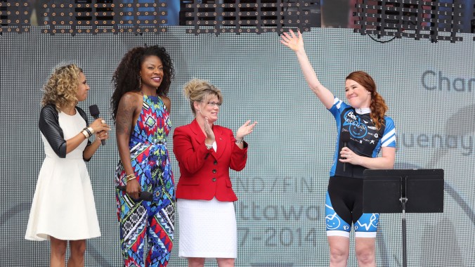 Hughes introduced to the crowd at the end of her 110-day bike tour of Canada.