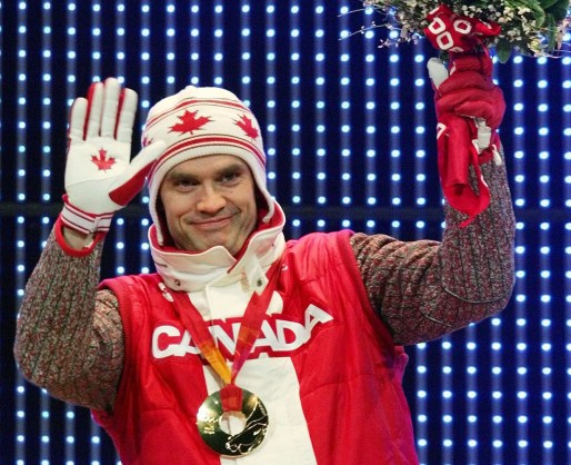 Canada's Duff Gibson celebrates his gold medal during the medal ceremony for the Men's Skeleton competition at the Turin 2006 Olympic Winter Games in Turin, Italy, Saturday Feb 18, 2006. (AP Photo/Greg Baker)