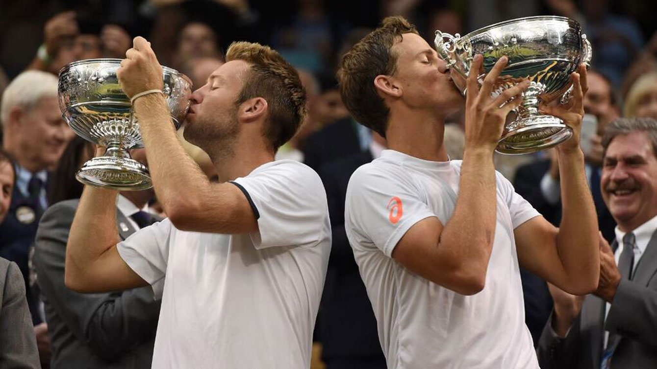 Jack Sock (left) & Canada's Vasek Pospisil win the Wimbledon men's doubles title. Photo via Tennis Canada. Photo: CP