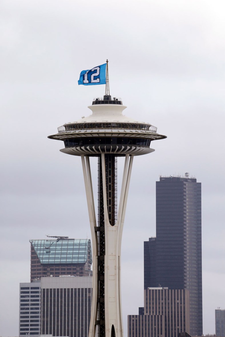 12th man flag atop Seattle's Space Needle. Photo: CP