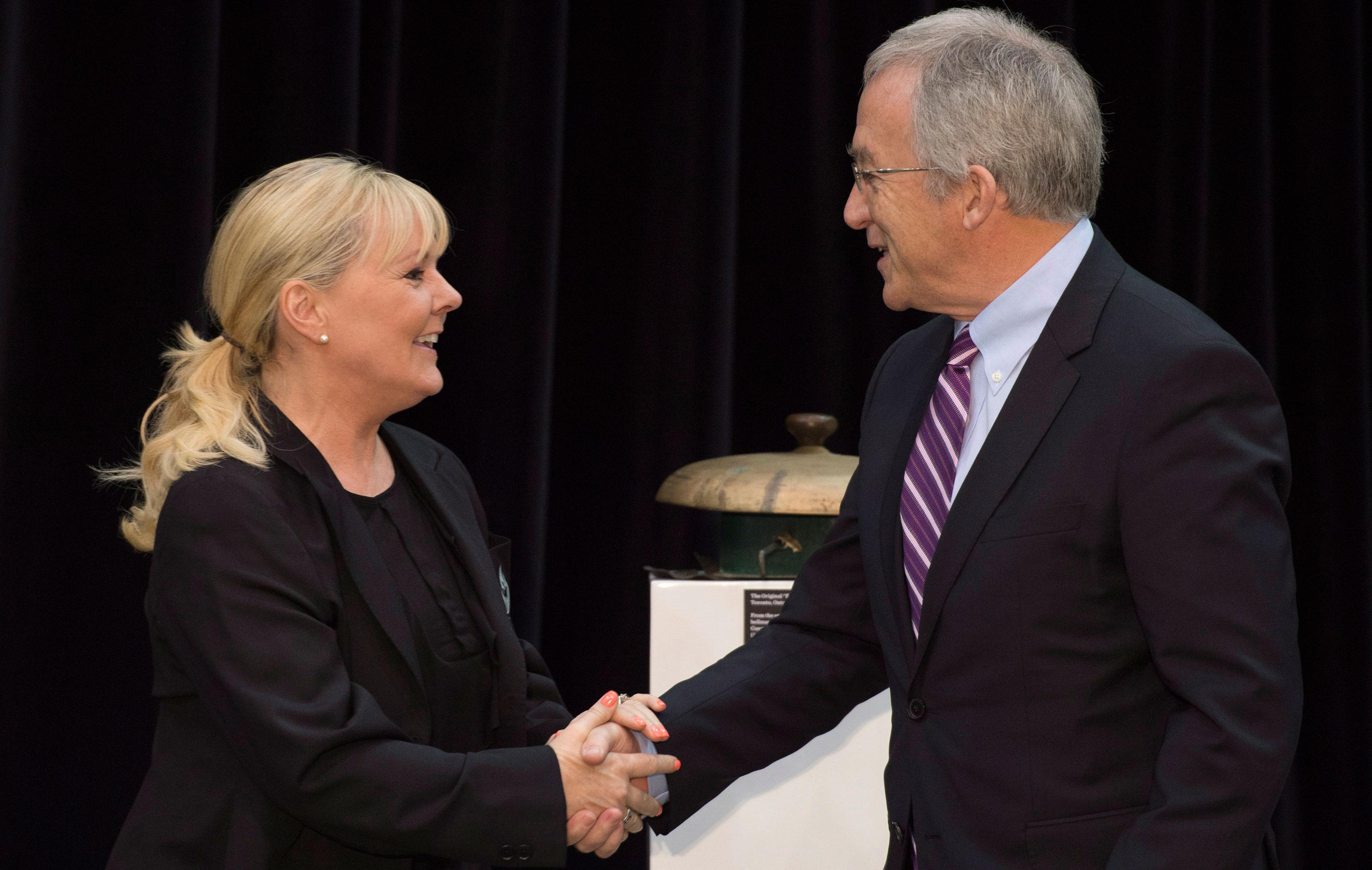 Elizabeth Manley congratulated by Colin MacDonald, chair of Canada's Sports Hall of Fame board of governors.