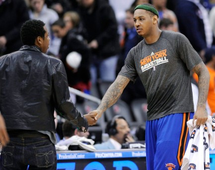 New York Knick Carmelo Anthony shakes hands with Jay-Z. Photo: CP