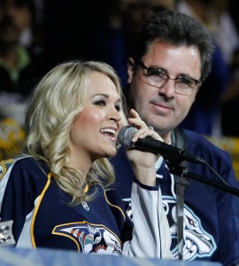 Underwood and Vince Gill performing during an intermission at a Predators playoff game in 2011. Photo: CP