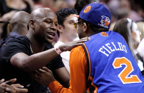 Boxer Floyd Mayweather Jr is greeted by Spike. Photo: CP