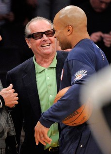 Nicholson jokes around with former Laker Derek Fisher. Photo: CP