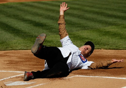 Bill Murray sliding into home at Wrigley before he throws out the first pitch.