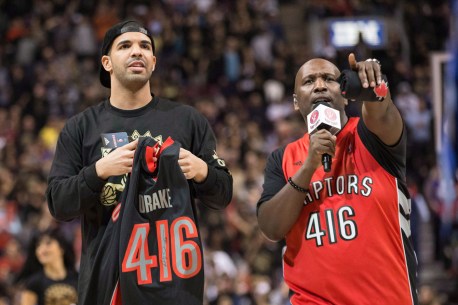 Drake chatting with the Raps announcer. Photo: CP