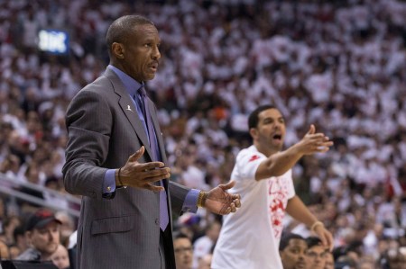 Drake can be seen disputing a call behind Raps coach Dwayne Casey. Photo: CP