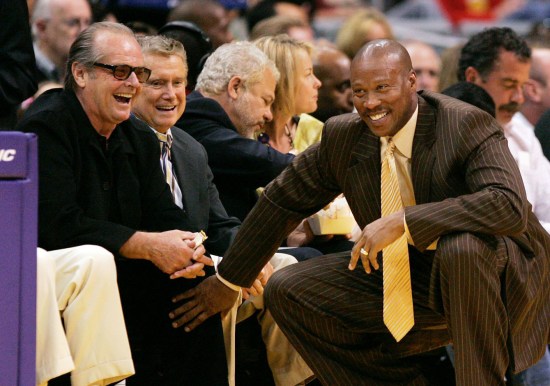 New Orleans Hornets coach, and former LA Laker, Byron Scott jokes with Nicholson during a game. Photo: CP