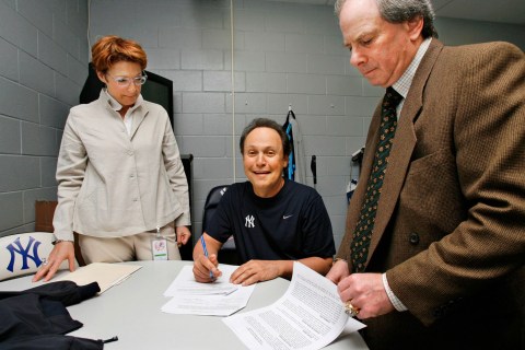 Billy Crystal signing his one day spring training contract. Photo: CP