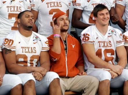 McConaughey sits with players during a team photo. Photo: CP