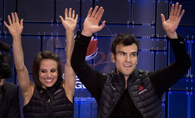 Meagan Duhamel and Eric Radford react to their score after the pairs free skate.