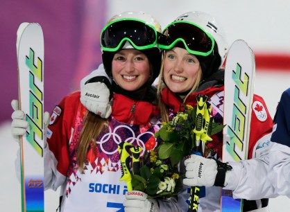 Justine and Chloé Dufour-Lapointe celebrate after winning gold and silver medals