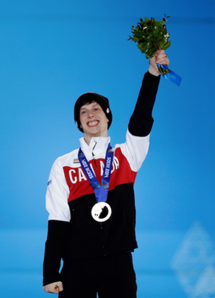 Men's 500-meter short track speedskating bronze medalist Charle Cournoyer of Canada celebrates during the medals ceremony at the 2014 Winter Olympics, Saturday, Feb. 22, 2014, in Sochi, Russia. (AP Photo/David Goldman)
