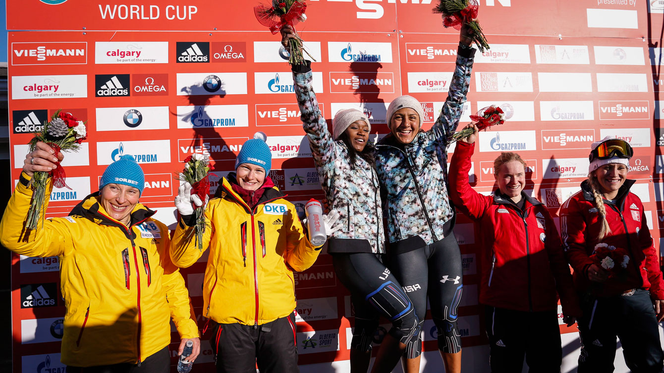 O'Brien stands next to Humphries (right side of podium) after her first World Cup bronze medal in bobsleigh. 
