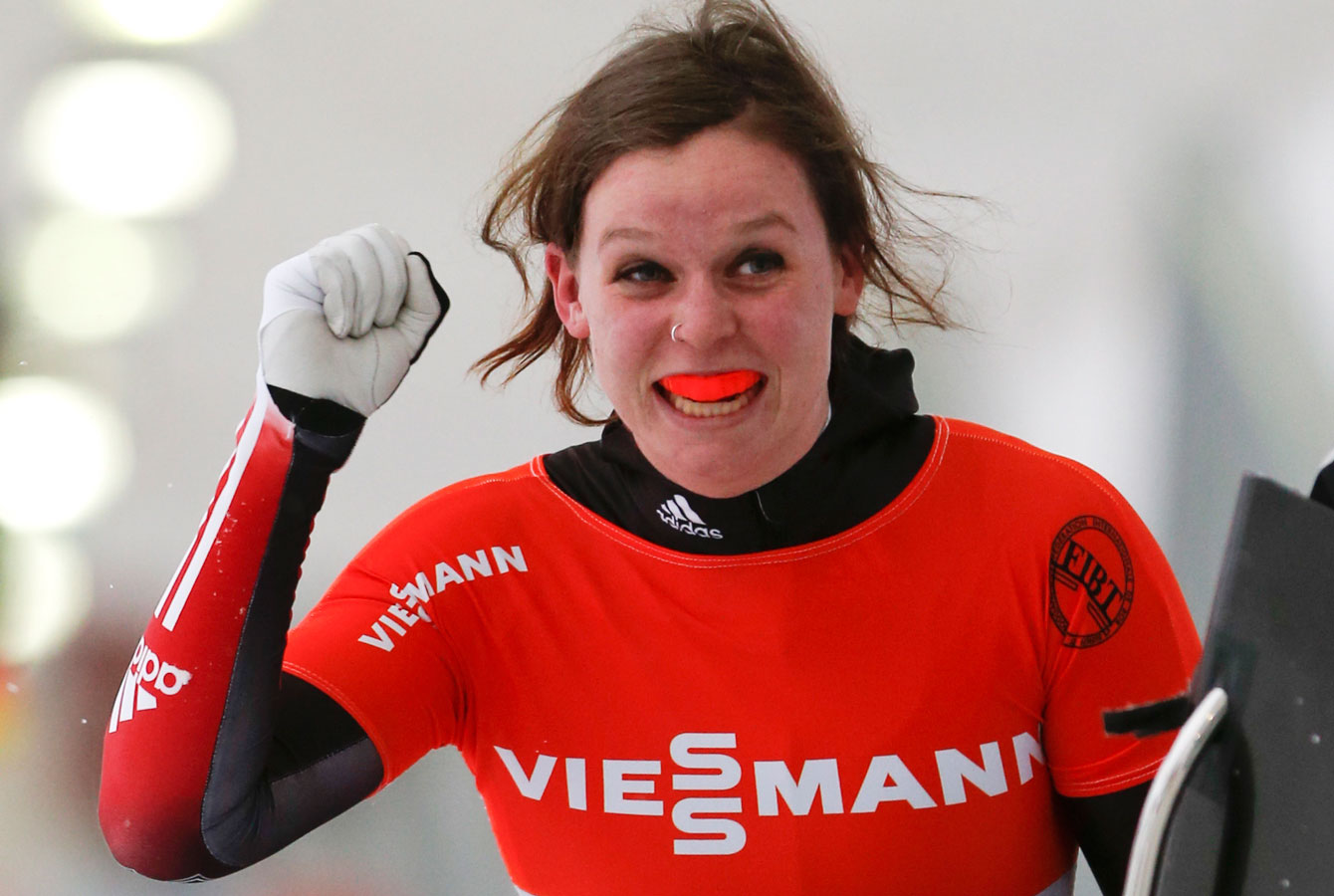 Elisabeth Vathje smiles through her mouthguard after taking a World Cup debut silver. 