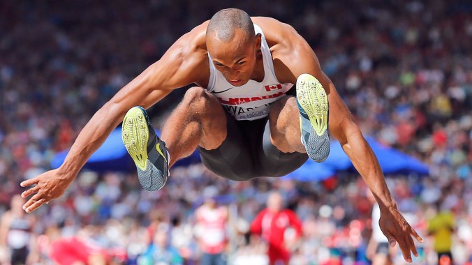 Commonwealth Games Decathlon gold medallist Damian Warner takes flight during the long jump.