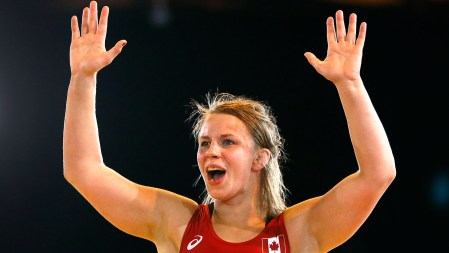 Erica Wiebe celebrates her wrestling gold medal