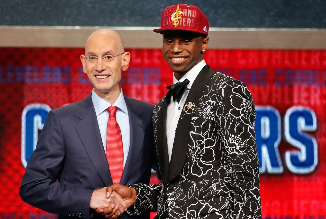 Andrew Wiggins (right) with NBA commissioner Adam Silver after being drafter first overall by the Cleveland Cavaliers. Wiggins was later traded to Minnesota. 