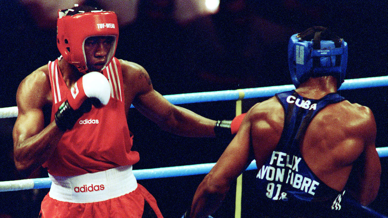 David Defiagbon in the heavyweight golden bout at Atlanta, before bringing home Canada's last Olympic boxing medal.