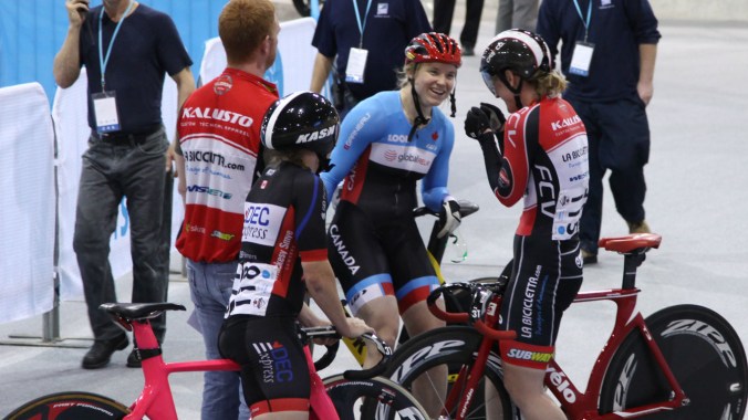 Kate O'Brien chats with fellow cyclists after one of her races at Milton Velodrome.