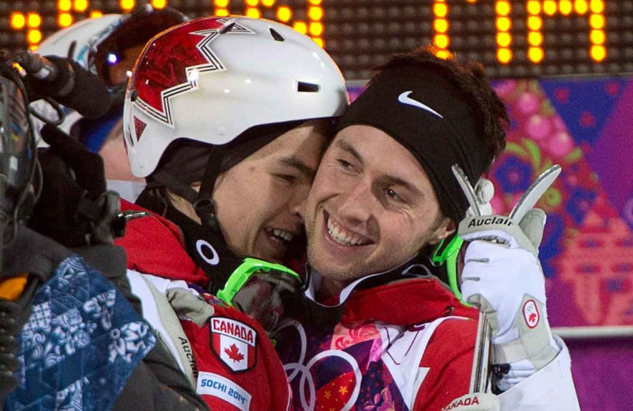 Mikaël Kingsbury (L) and Alex Bilodeau (R) celebrate after their moguls triumph.