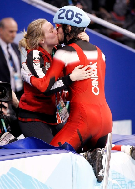 Canada's Charles Hamelin kisses Marianne St-Gelais after winning the gold medal in the men's 500 meter final in the short track speedskating competition Friday February 26, 2010 at the Vancouver 2010 Olympic Winter Games in Vancouver. THE CANADIAN PRESS/Paul Chiasson