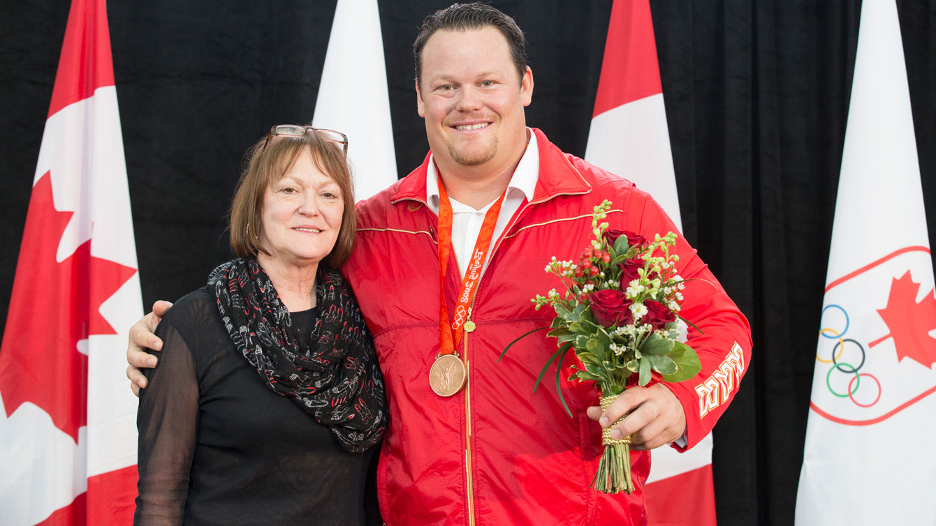 Dylan Armstrong with his mother Judy, who was a tireless planner for the medal ceremony. 