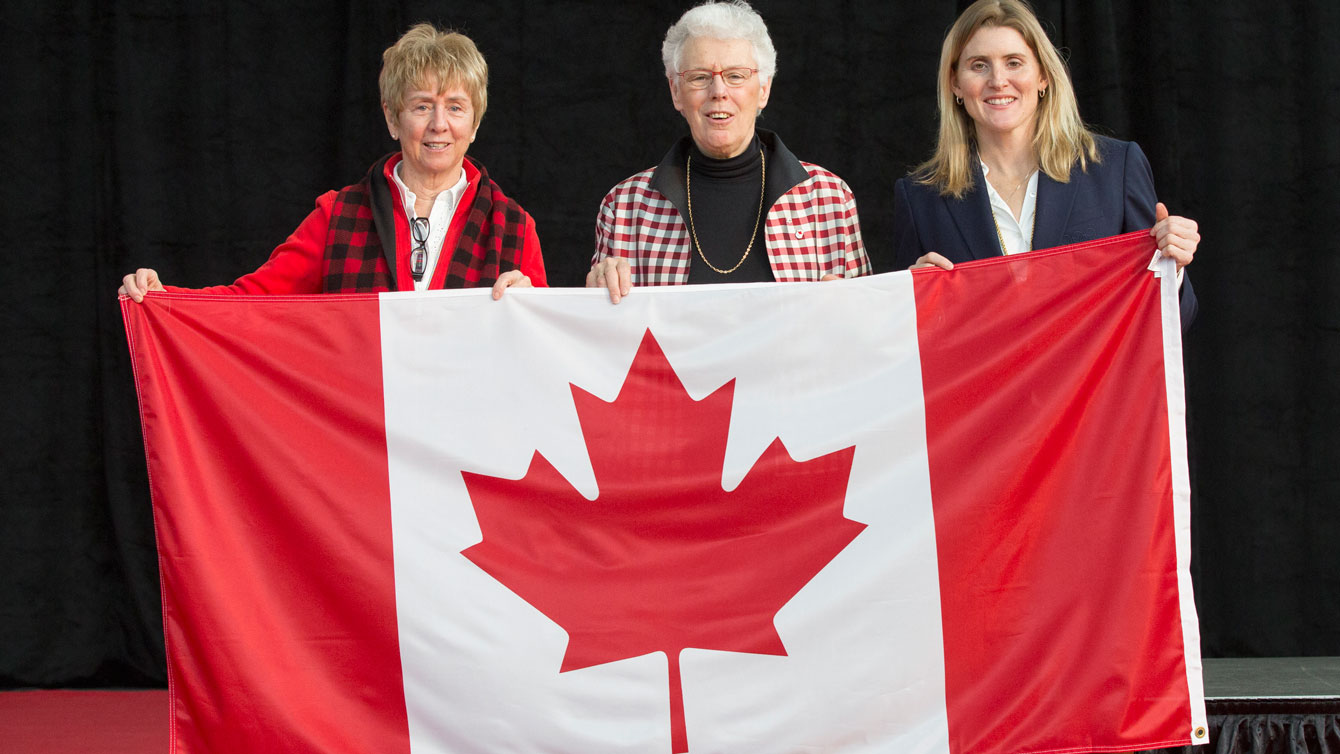 Nancy Greene (left) was the first Olympian ever to carry the maple leaf into an Olympic Games. Abby Hoffman (middle) was the first to do it on Canadian soil. Hayley Wickenheiser (right) was the most recent ‪Team Canada‬ Opening Ceremony flag bearer. All were at Dylan Armstrong's medal ceremony.