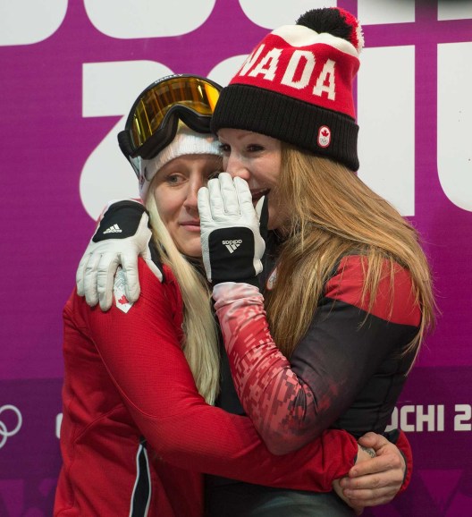 Kaillie Humphries and Heather Moyse await the results of bobsleigh competition in Sochi.