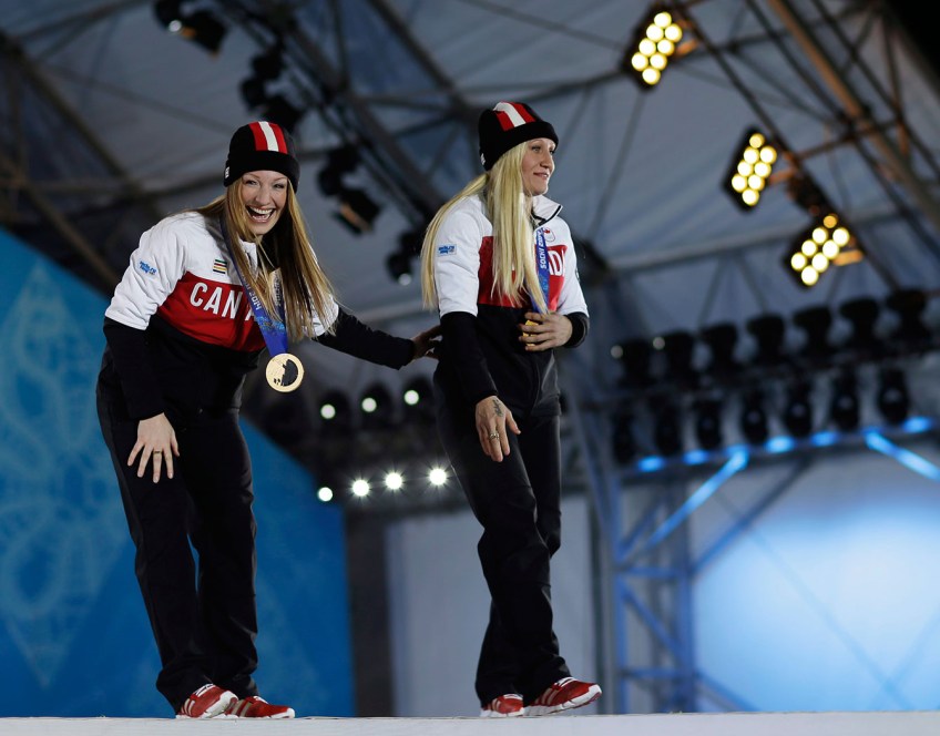 Kaillie Humphries (R) and Heather Moyse (L) at the victory ceremony for bobsleigh in Sochi.