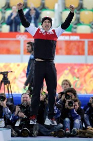 Denny Morrison jumps before the podium after winning silver in the 1000m at Sochi.
