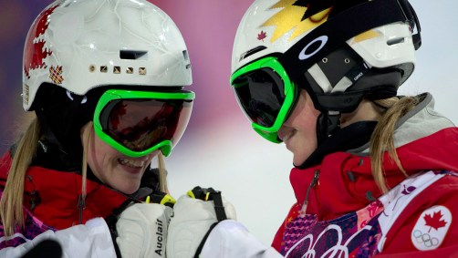 Fist bump! The Dufour-Lapointe sisters celebrate their gold-silver performance.