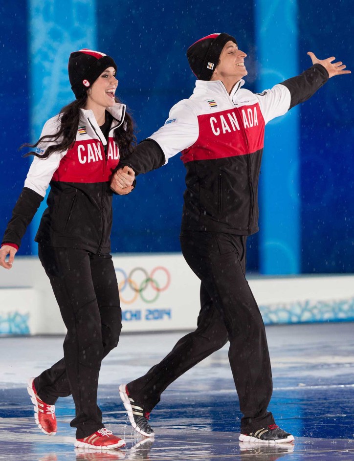 Tessa Virtue and Scott Moir at the victory ceremony for ice dance in Sochi.