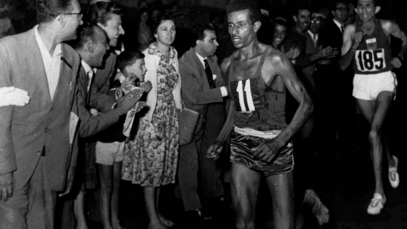 Abebe Bikila run the Olympic marathon barefoot through the streets of Rome. 