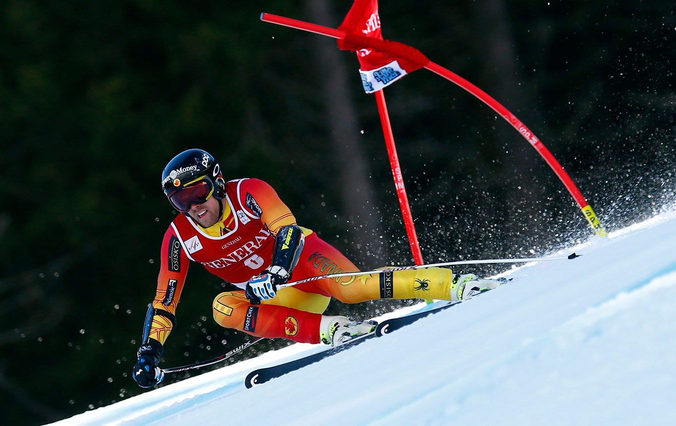 Dustin Cook speeds down the Super-G course in Kvitfjell, Norway, Sunday, March 8, 2015. (AP Photo/Alessandro Trovati)