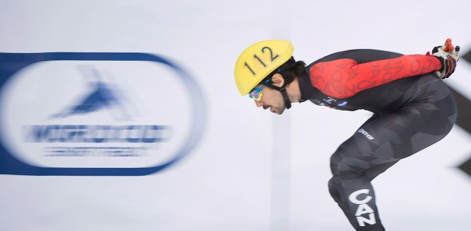Charles Hamelin from Canada warms up prior to competing in the men's 500-metre event at the ISU World Cup Short Track Speedskating competition in Montreal, Sunday, November 16, 2014. THE CANADIAN PRESS/Graham Hughes