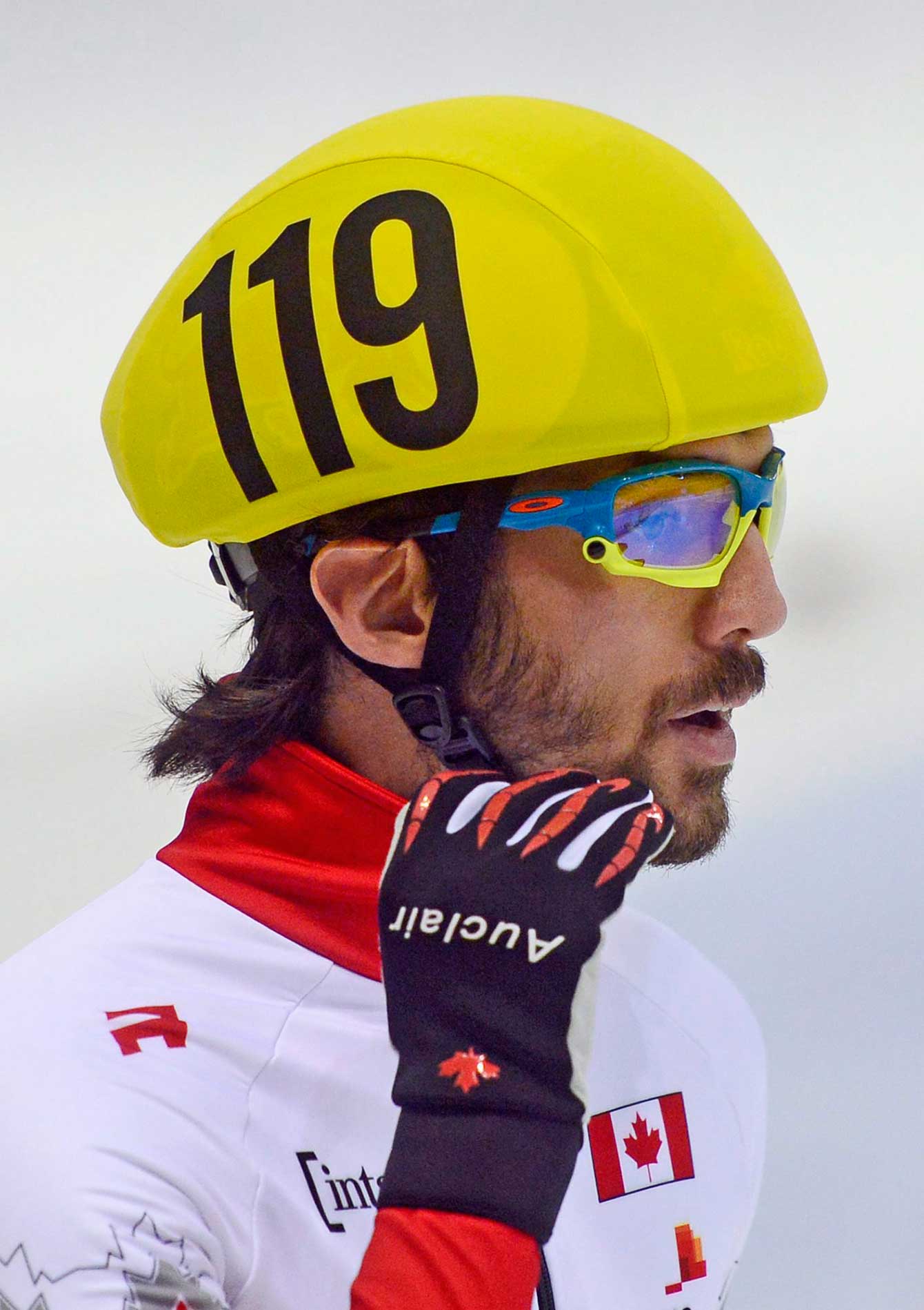 Olympic champion Charles Hamelin of Canada gestures after the men's 1,500 meters preliminaries at the World Cup short track speed skating championship in Dresden, Germany, Friday, Feb. 6, 2015. The ISU World Cup runs from Feb. 6 to Feb. 8. 2015. (AP Photo/Jens Meyer)
