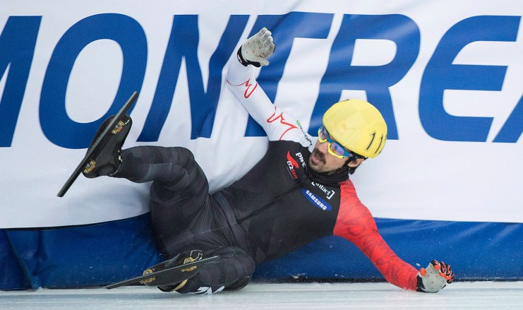 Canadian Charles Hamelin crashes out of his 1,500-metre semifinal race at the ISU World Cup Short Track Speedskating competition in Montreal, Saturday, November 15, 2014. THE CANADIAN PRESS/Graham Hughes