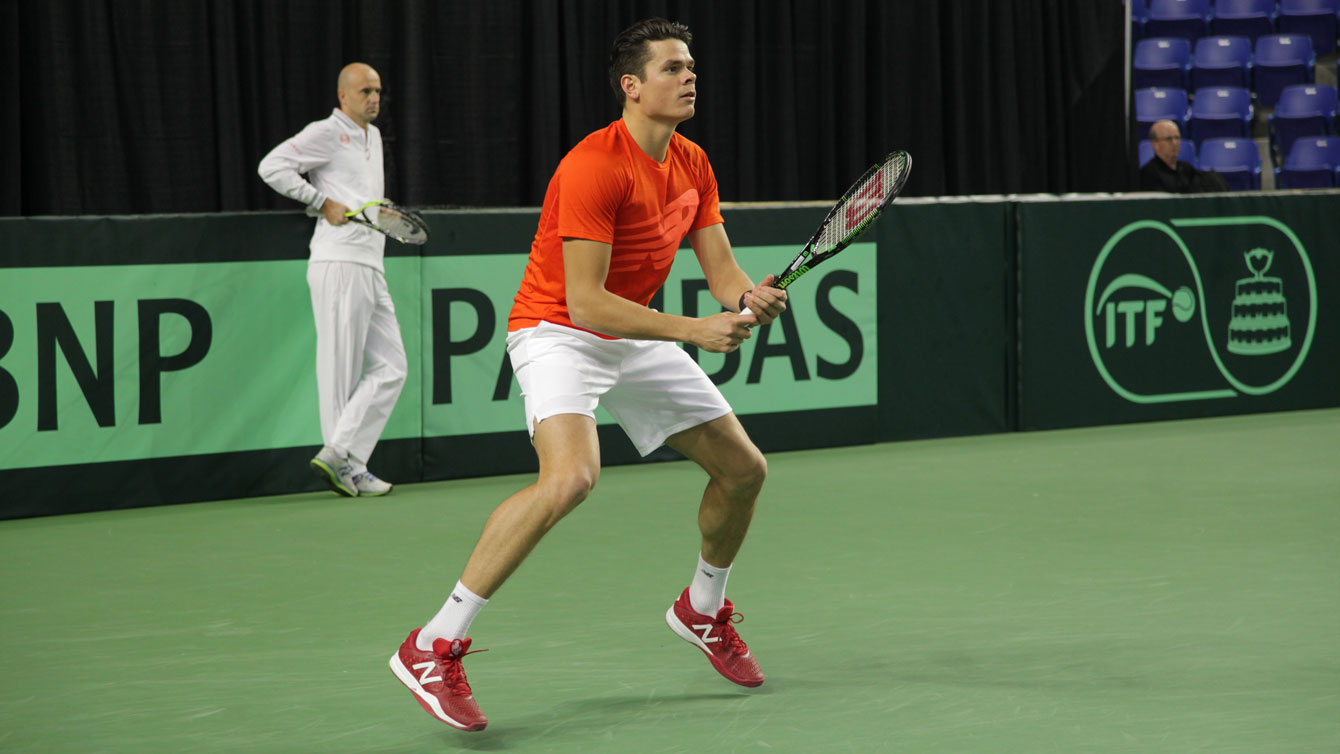 Milos Raonic prepares to receive serve as his personal coach Ivan Ljubičić watches during a practice session at the University of British Columbia on Wednesday.