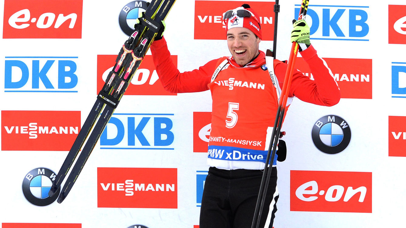 Nathan Smith celebrates atop the World Cup biathlon podium in Russia, March 21, 2015. 