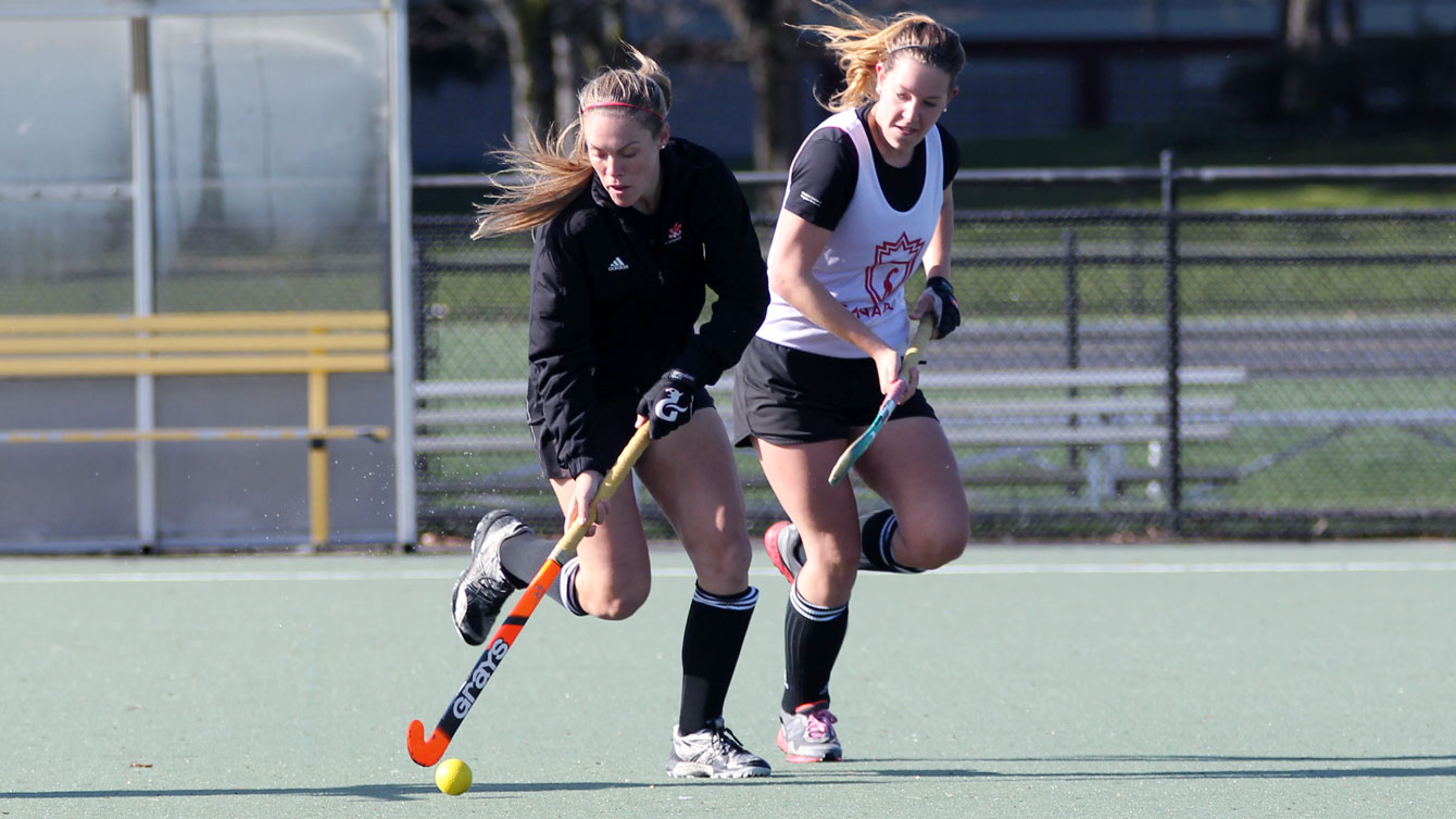 Brienne Stairs (left) dribbles at training. She is one of the top women's field hockey goal scorers in the world.