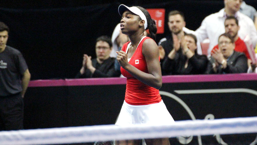 Francoise Abanda gives a slight fist pump as she starts her comeback in the Fed Cup victory of Irina-Camelia Begu of Romania, April 18, 2015. 