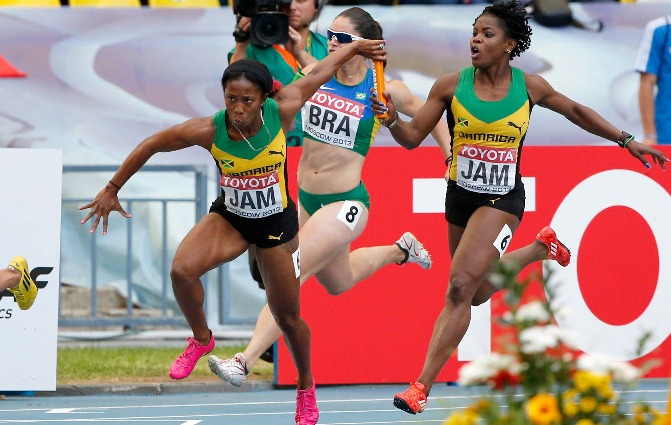 Shelly-Ann Fraser-Pryce takes the baton for the final leg of the women's 4x100m relay at Moscow 2013.