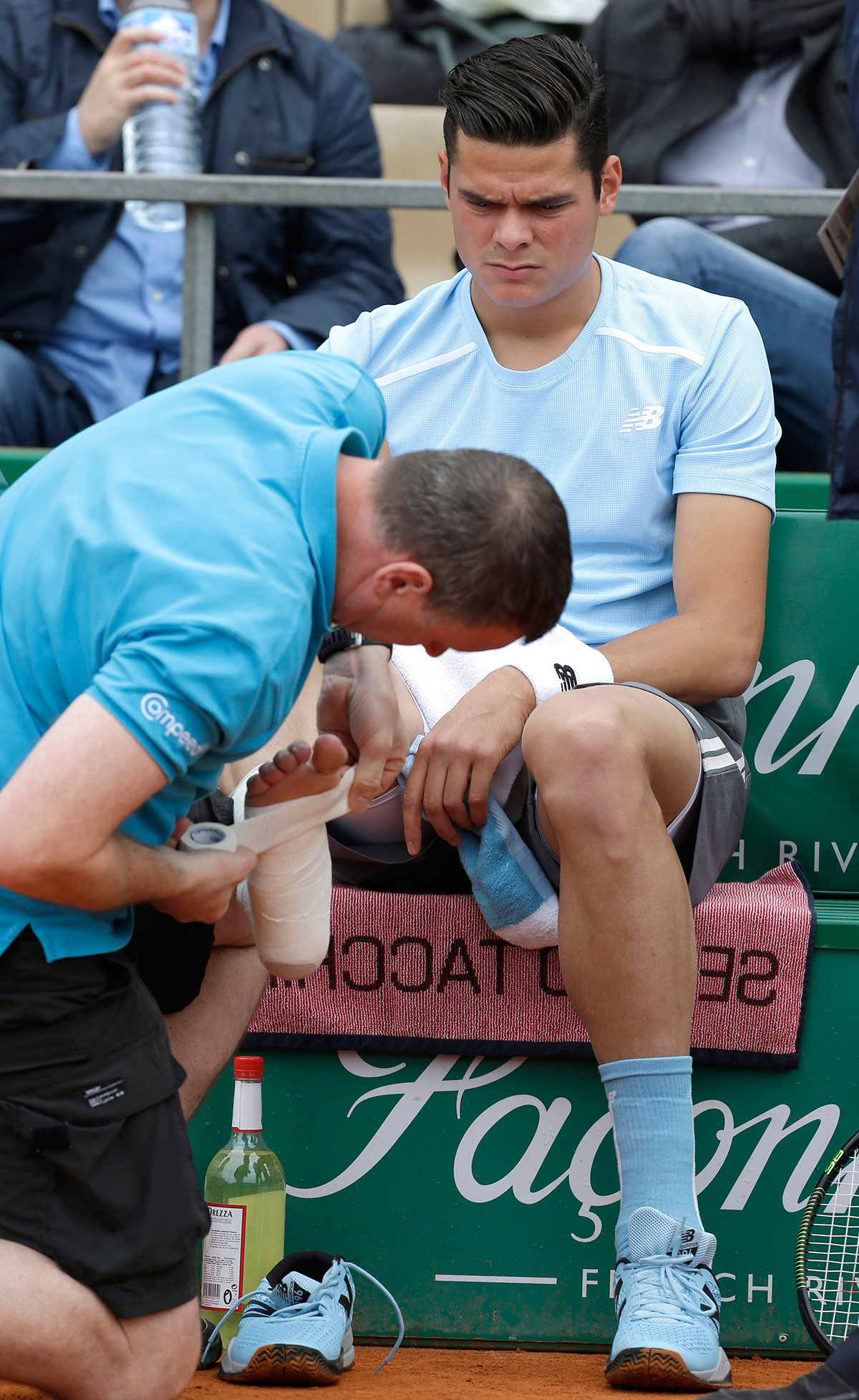 Milos Raonic receives medical treatment to his right foot in his third round Monte Carlo Masters match against Tommy Robredo.