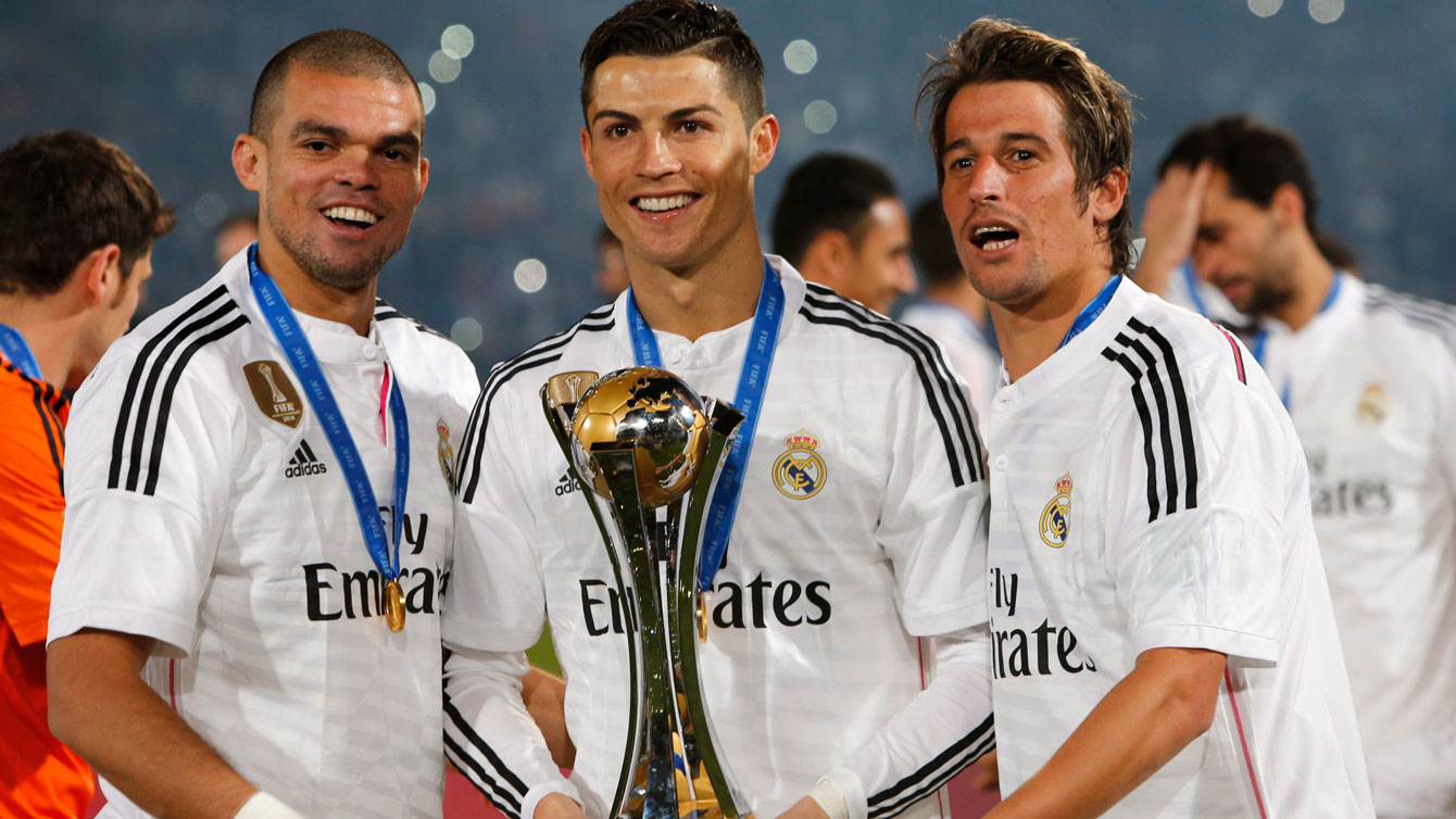 Real Madrid players hold up the FIFA Club World Cup trophy. Real Madrid beat the CONCACAF champion, Cruz Azul, on way to lifting the 2014 title.