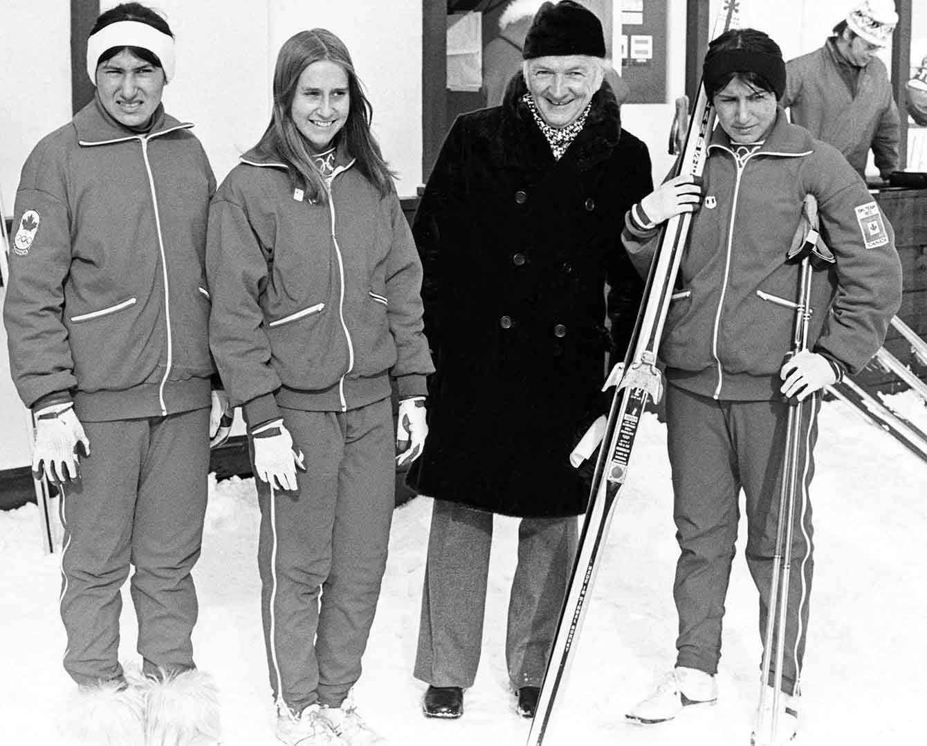 Group photo in black in white. Sharon Firth is holding her skii's