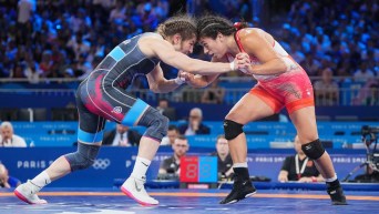 Justina Di Stasio grapples with an opponent