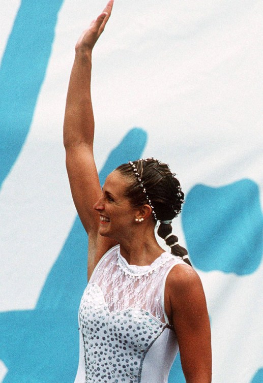 Sylvie Fréchette celebrates her silver finish, later awarded gold after a judging error at the Barcelona 1992 Olympic games 