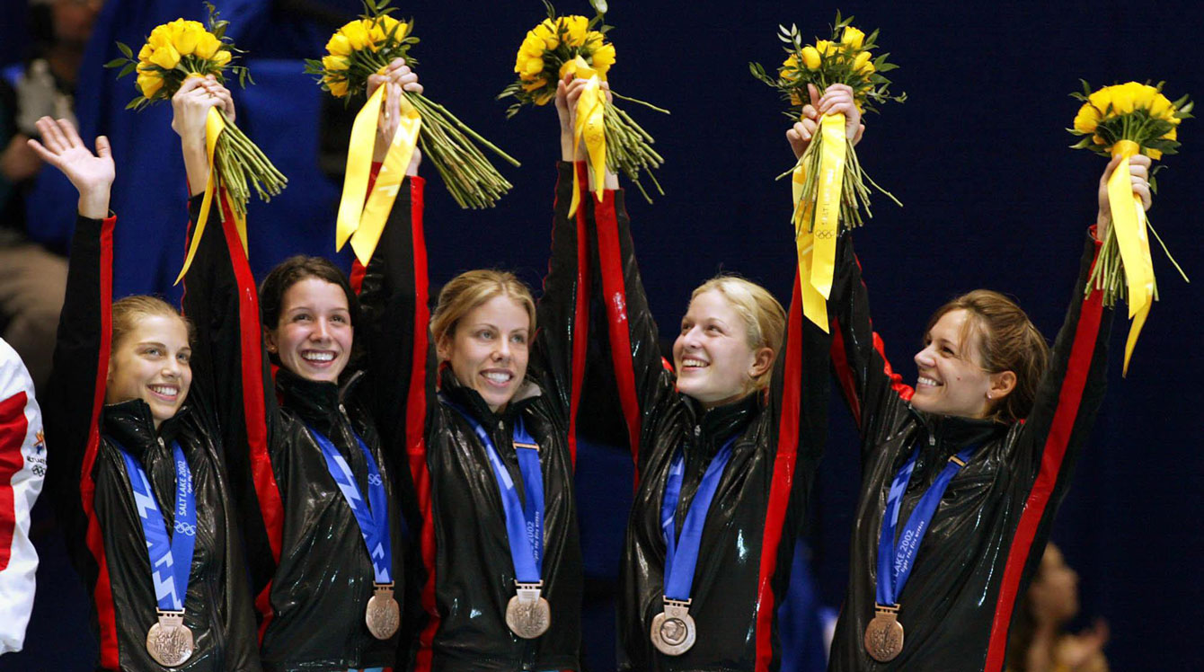 Isabelle Charest (far right) celebrates the bronze medal in team pursuit at Salt Lake City 2002. 